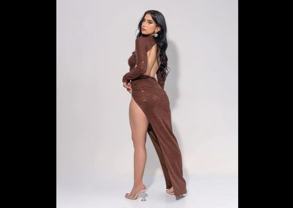 Elegant and beautiful Spanish woman poses in revealing dress.
